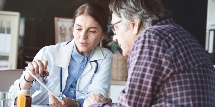 Doctor with patient in medical office