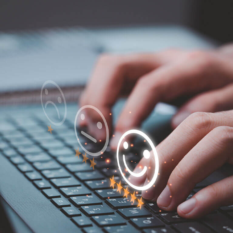 hands on a computer keyboard taking an online survey