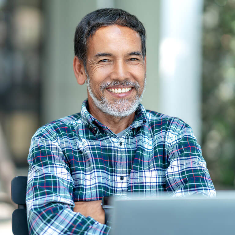 happy man working on laptop