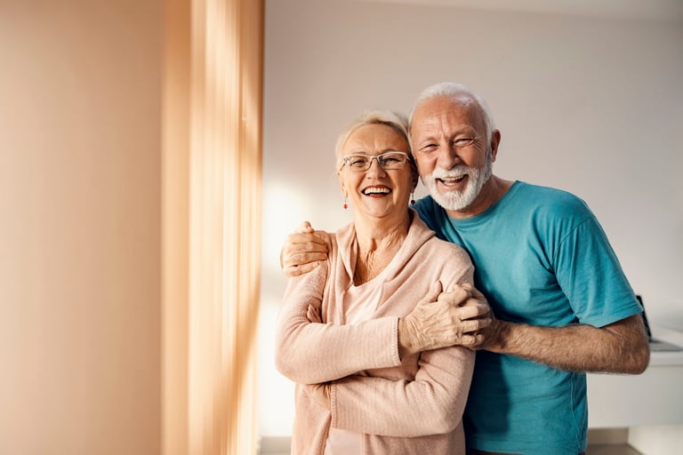 Senior couple hugging in a nursing home